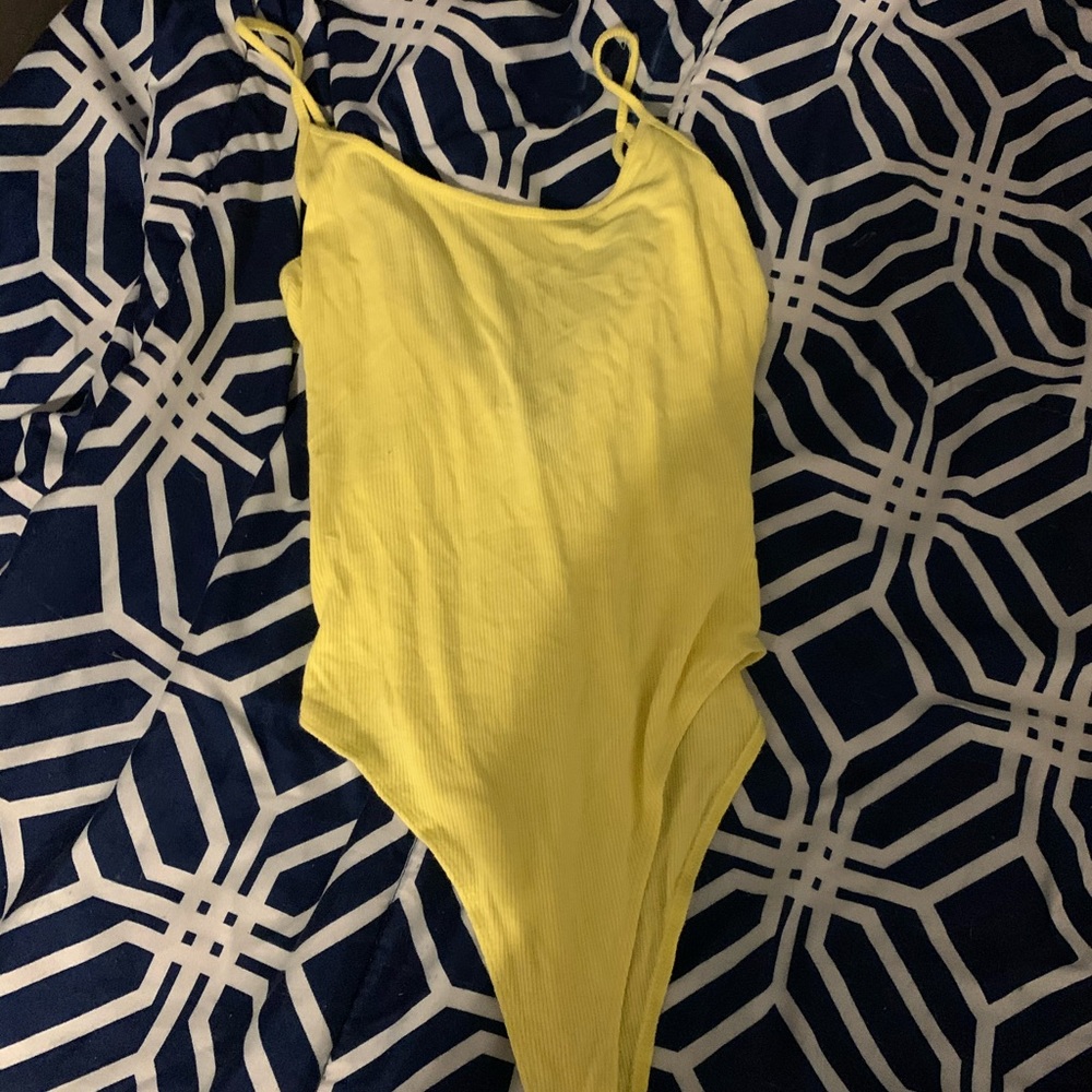yellow body suit